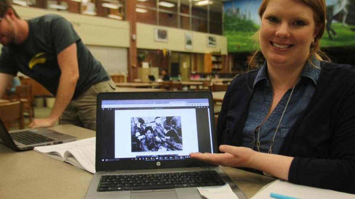 Anna Hasenkamp, seventh grade math teacher at Williams Middle School, loves to show her students images like these from D-Day because the men involved were so young. She says it usually hits close to home for the students.