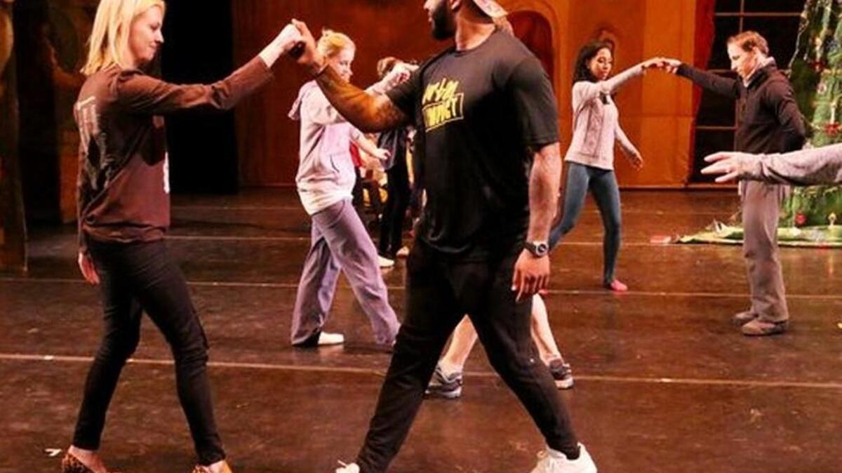 Former Clemson University quarterback Tajh Boyd, middle, dances with Leslie Haas during a dress rehearsal of The Nutcracker at The Peace Center in Greenville on Tuesday night, December 20, 2016. Boyd will be featured in a small role of the play.