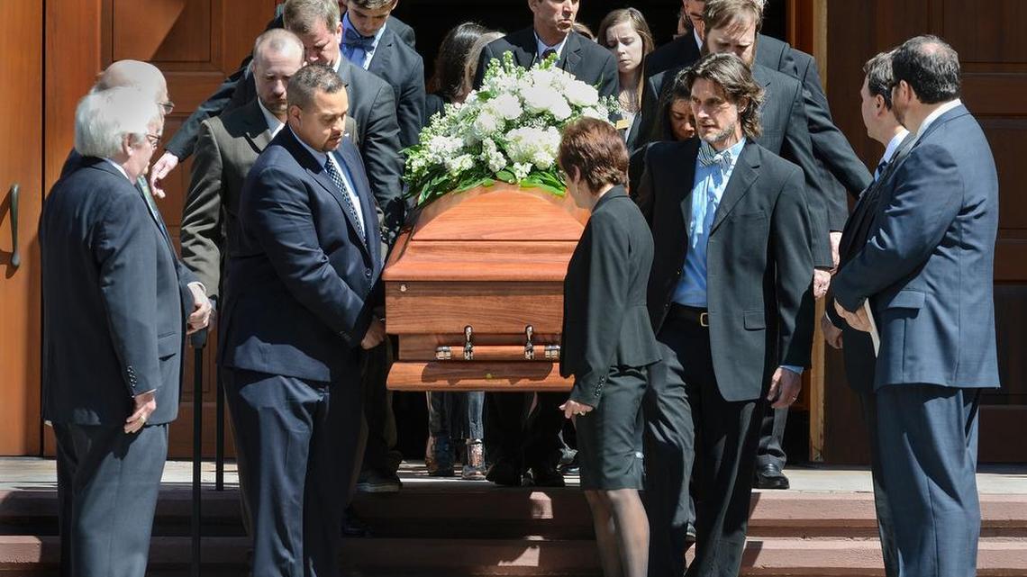 Pallbearers carry author Pat Conroy's casket from the church following his funeral on Tuesday. The funeral was held at St. Peter's Catholic Church on Lady's Island.