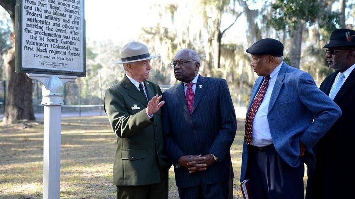 Then-National Park Service director Jonathan Jarvis, from left, speaks with U.S. Rep. Jim Clyburn and Port Royal Mayor Sam Murray at the Camp Saxton site on the grounds of Naval Hospital Beaufort in December.