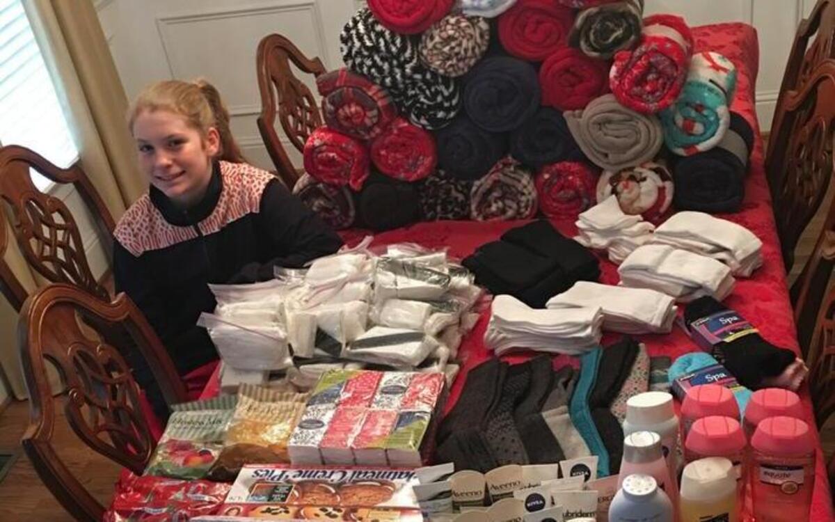Logan Hamel, 12, sits at a table full of gifts she collected for senior adults at White Oak Manor in York.