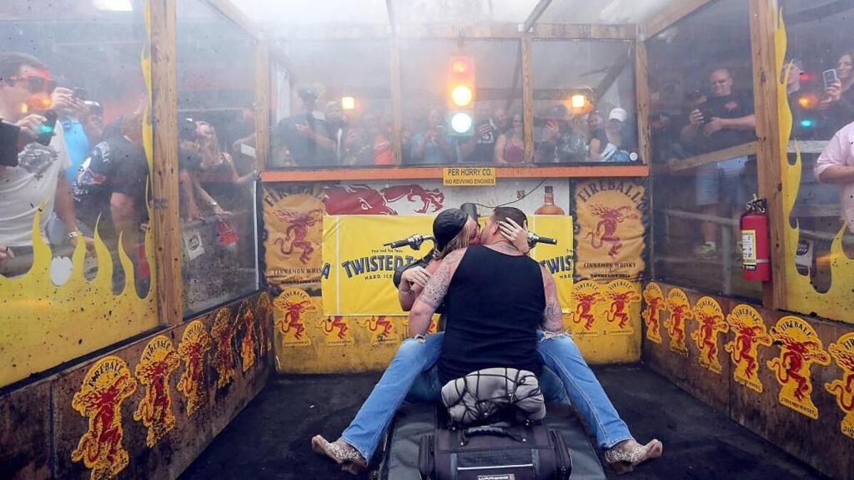 Jonathan and Martha King are spending some time in the burn out pit while on their honeymoon at Suck Bang Blow on Thursday, May 19, 2016. The couple are from Staunton, Va., and were married a week ago. Jonathan said their honeymoon choices included Hawaii, but Martha chose Murrells Inlet for the annual Myrtle Beach Bike Week Spring Rally. The rally continues along the Grand Strand through the weekend. Events span the coast from Little River to Georgetown.