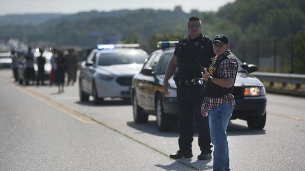 Officers at the scene of a shooting at Southside High School on Friday.