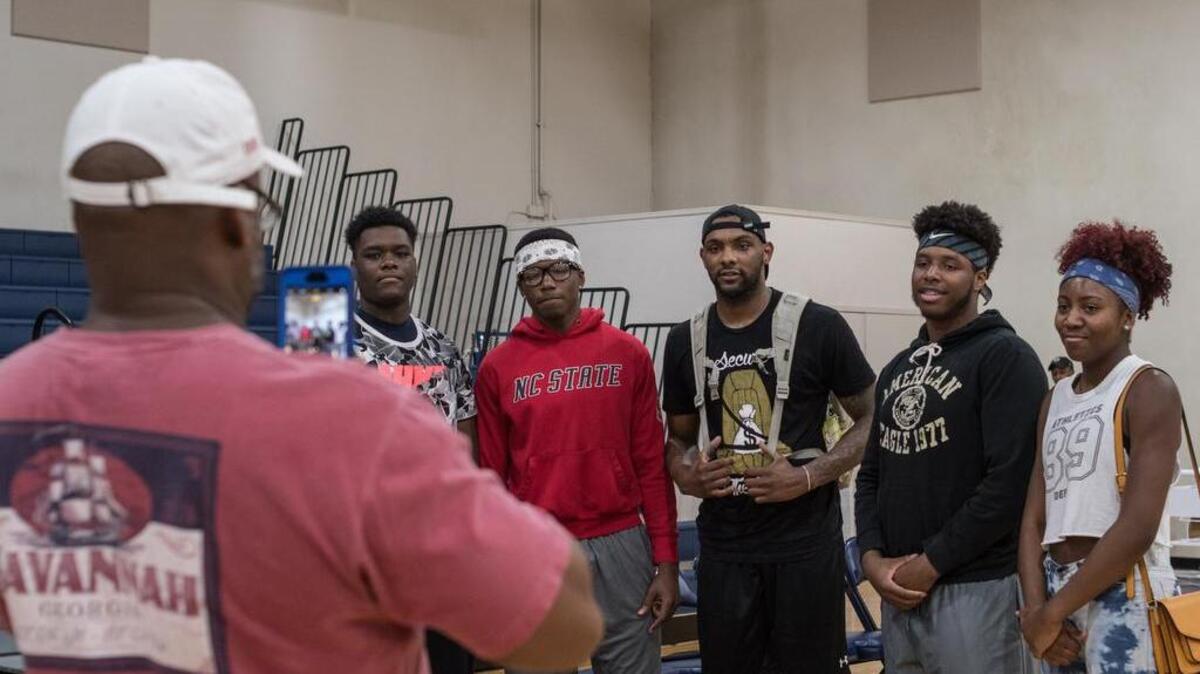 L.A. Clippers player and former USC star Sindarius Thornwell signs autographs and takes photos with fans following his game.