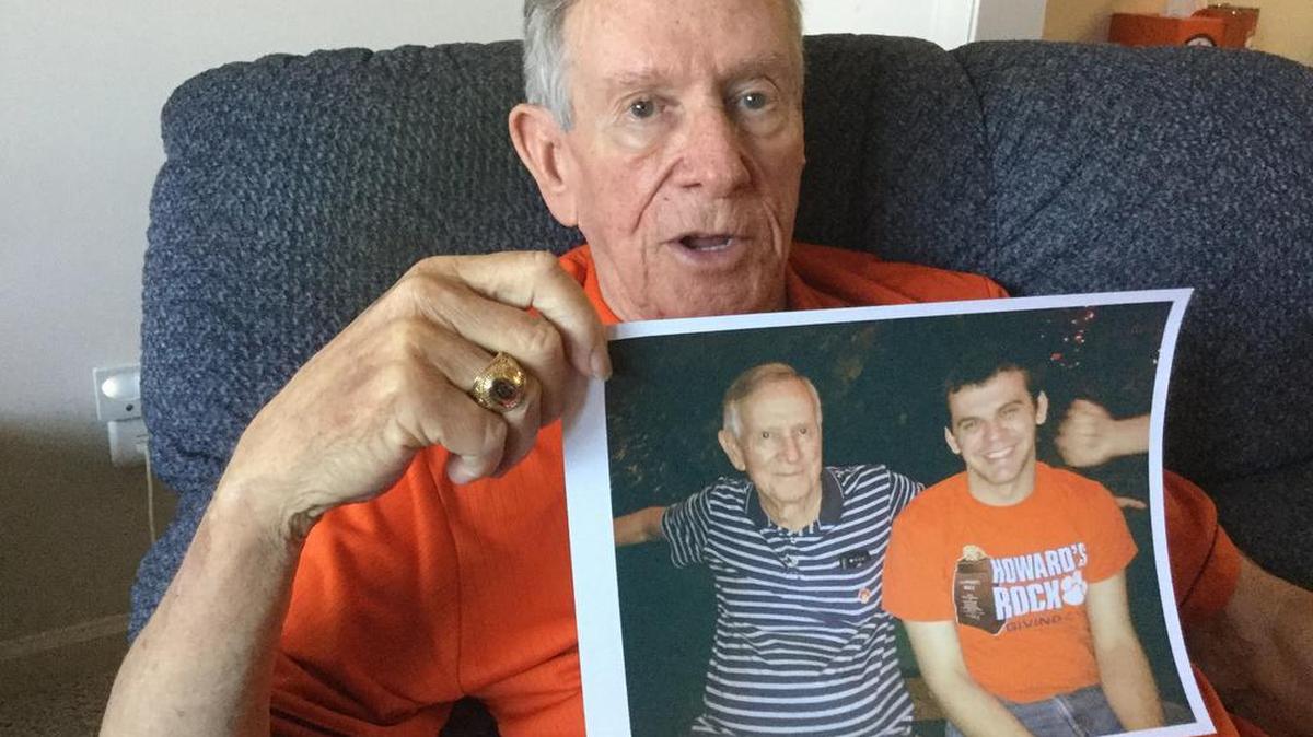 Charlie Funderburke, of Rock Hill, holds a 2016 picture of he and his grandson Seth Thomas. Thomas, a medical student, died last week after a fall while hiking in Peru.
