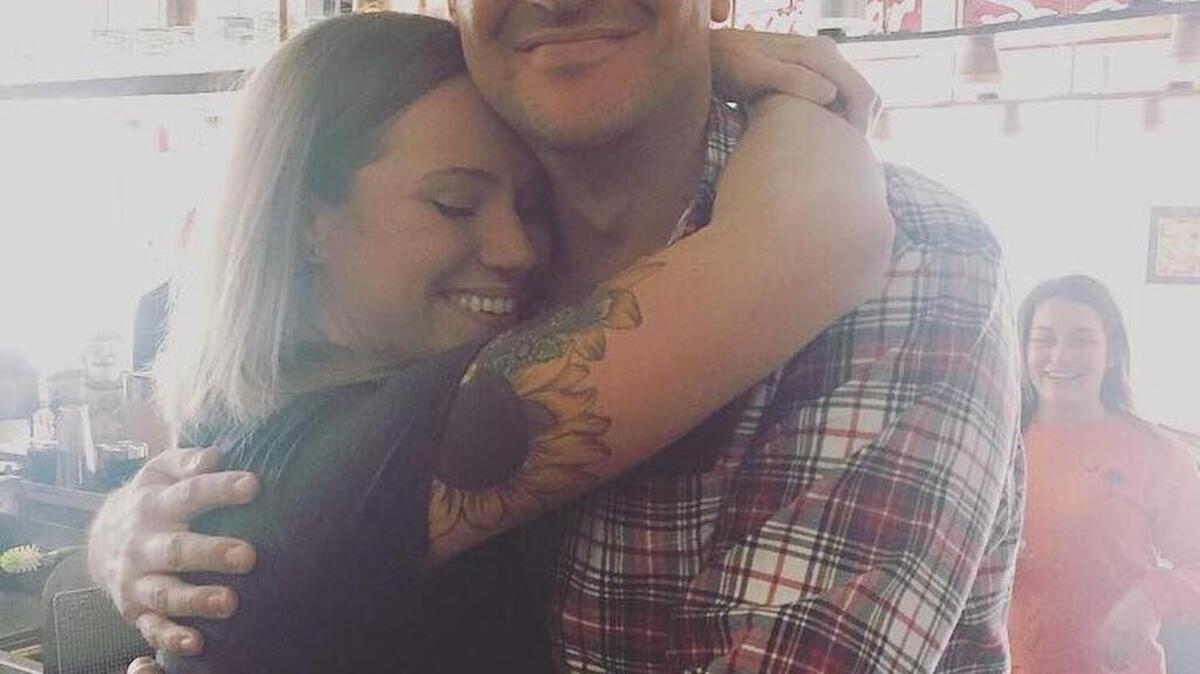 Kris Kaser, manager at Corner Perk coffee shop in Old Town Bluffton, hugs actor Jason Segel, who stopped in for a hot latte with almond milk Monday afternoon.