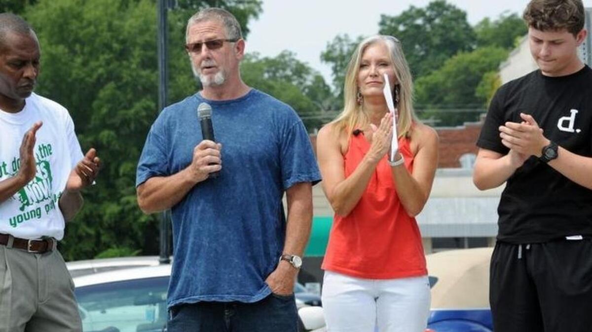 
Paul Hammond, father of Zach Hammond, speaks at a Rally for Justice for his son in Seneca on Saturday. At left is Jack Logan, organizer of the event, with Zach’s mother Angie and brother Dylan at right. 
