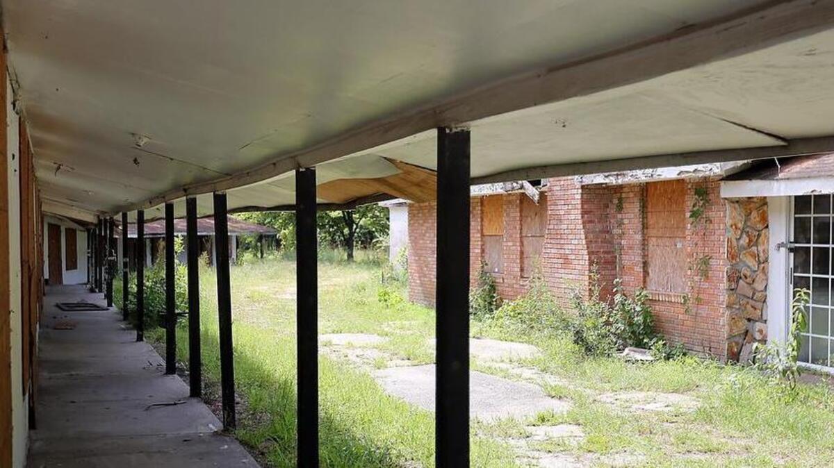 The closed and boarded Fitzgerald Motel on Carver Street is located beside an empty lot that was the home to the legendary Charlie’s Place.