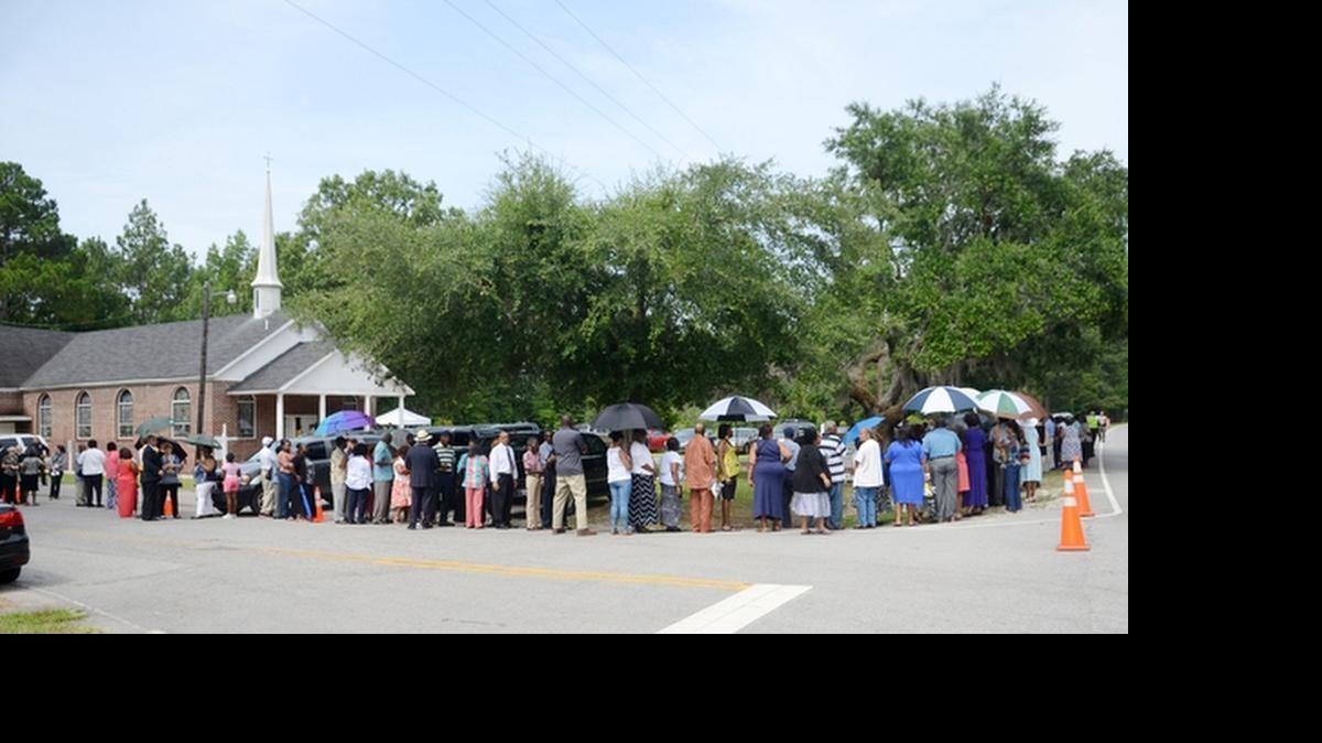 
Mourners line up outside St. John AME Church in Ridgeland on Thursday. Clementa Pinckney grew up in Ridgeland and attended the church as a youngster. 
