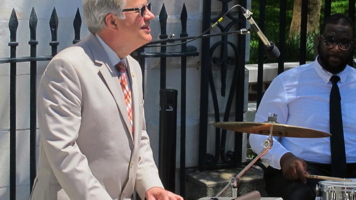 Charleston Mayor John Tecklenburg plays keyboards with a jazz combo just before the opening ceremonies of the 40th Spoleto Festival USA in front of city hall in Charleston.