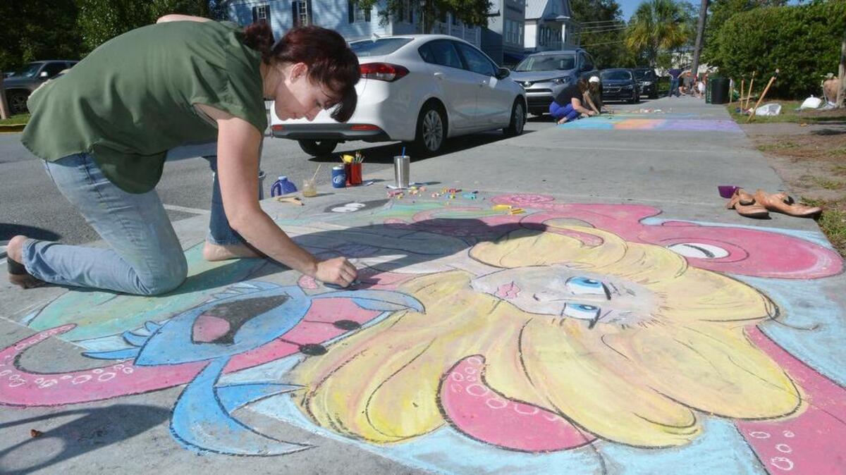 File photo. Chalk artist Lauren Brooks, of Bluffton, puts the finishing touches on her piece, which she called "Mermaid of Bluffton" during the inaugural Chalk the Walk event on Calhoun Street in Bluffton.