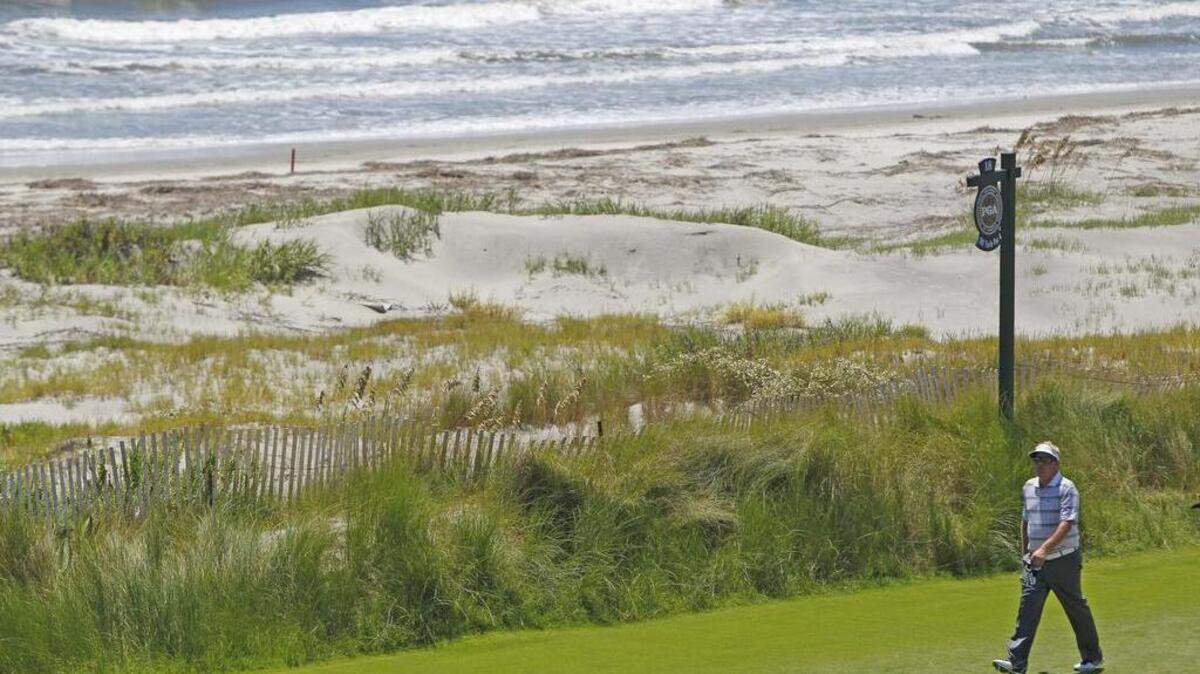 Carl Pettersson heads to his ball after hitting his tee shot on No. 18 during first round action of the 2012 PGA Championship at the Ocean Course on Kiawah Island.