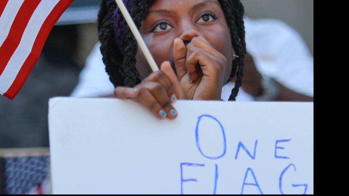 
Asha Jones shows support for the reming of the Confederate battle flag from the SC State House last month.
