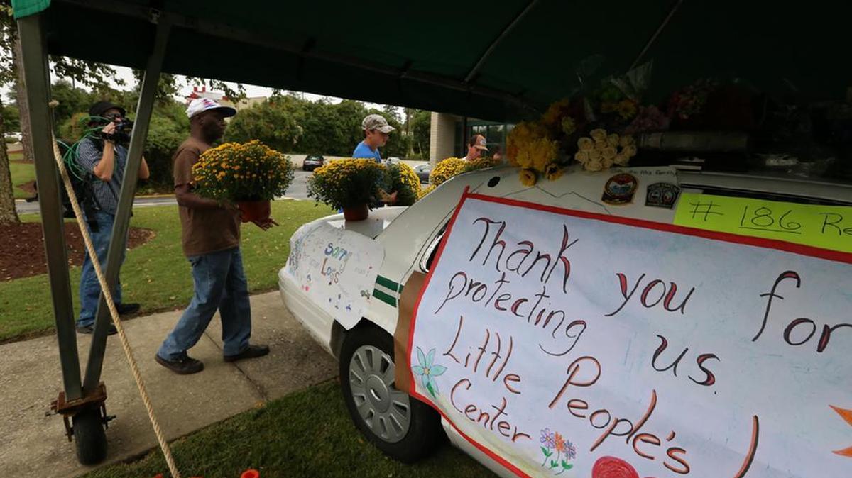 
Forest Acres residents brought flowers to the police department to pay respects to Officer Greg Alia, 32, who was shot to death after three officers responded to a report of a suspicious person Wednesday at Richland Mall.
