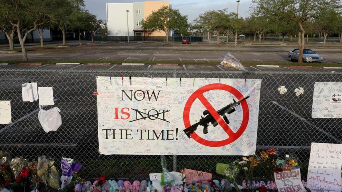 A sign that greeted teachers and school administrators when they returned to Marjory Stoneman Douglas High School for the first time after 17 were killed in a mass shooting.
