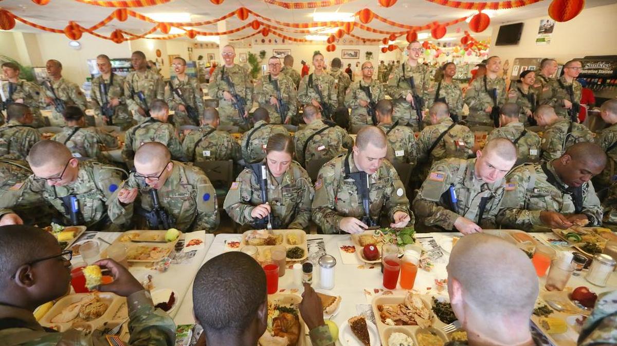 Soldiers in their first week of basic training sit down to a traditional Thanksgiving meal at Fort Jackson.