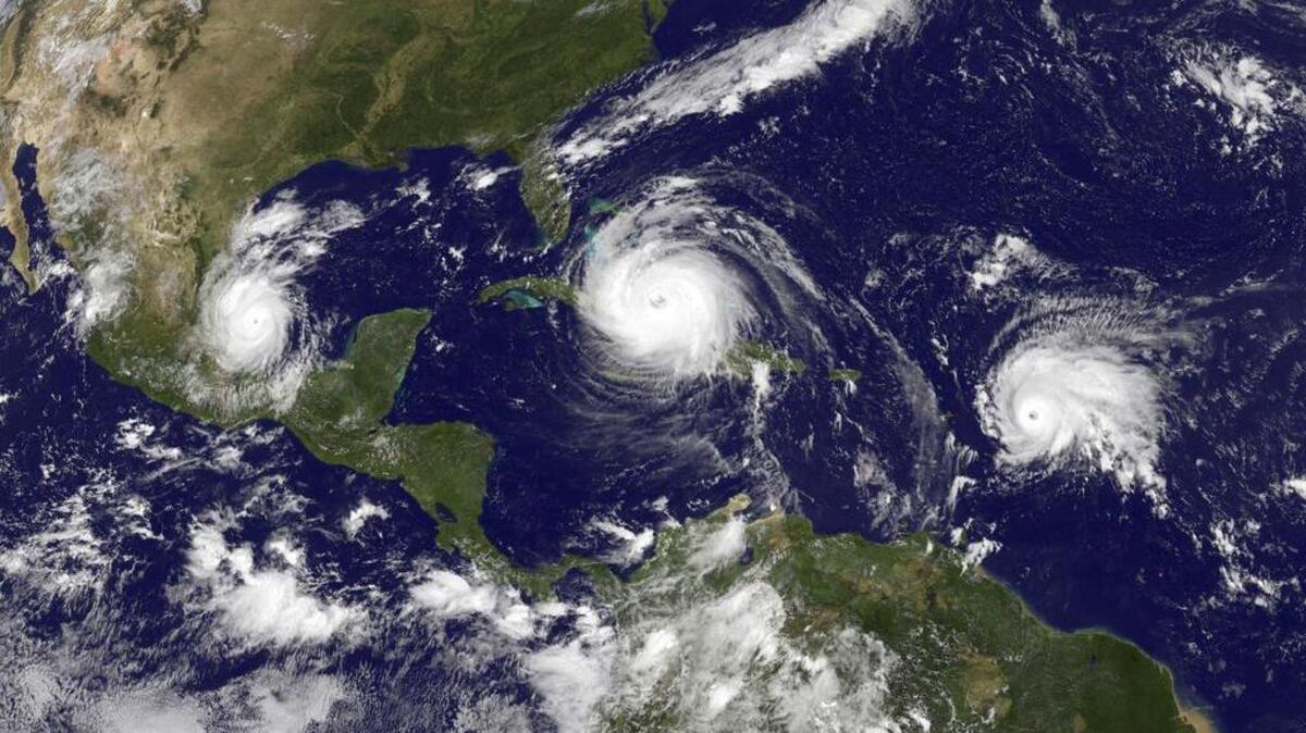 A satellite image from Sept. 8 shows, from left, Tropical Storm Katia, Hurricane Irma and Tropical Storm Jose, which would intensify into a hurricane. The 2017 Atlantic hurricane season has been unusually active.