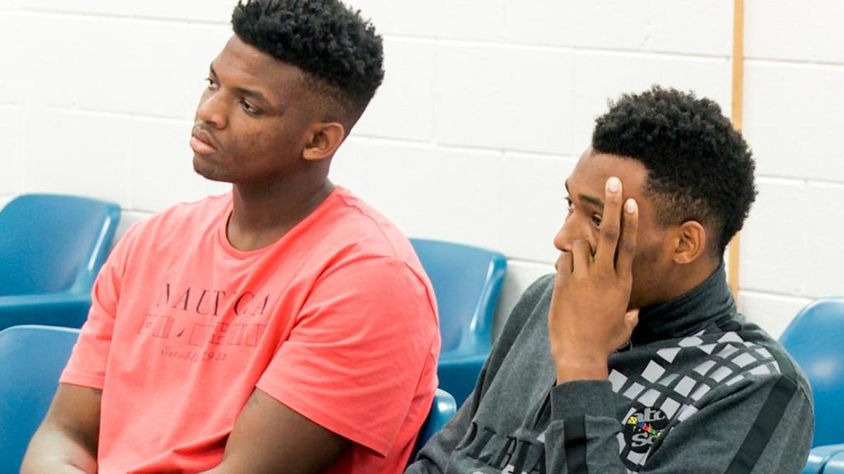 Eric Cobb, left, and Jamall Gregory wait in bond court. The suspended USC basketball players were released on personal recognizance bonds.