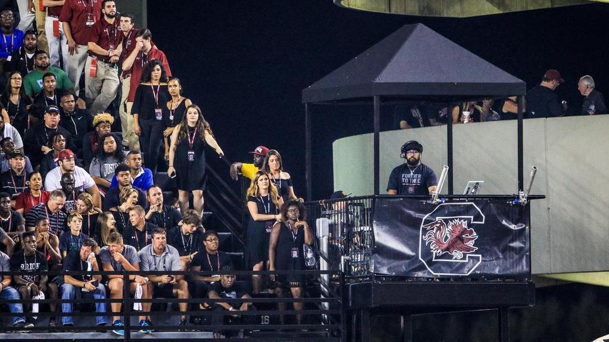 A DJ plays tunes at a USC home game.