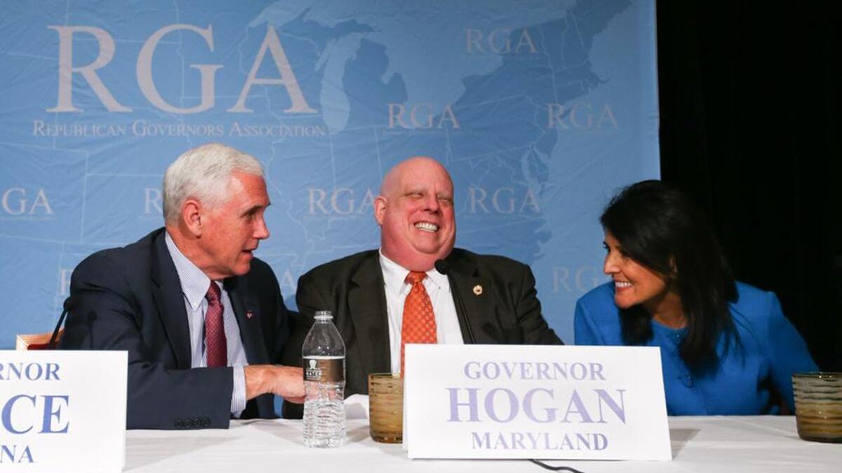 SC Gov Nikki Haley consults with Indiana Gov Mike Pence, left and Maryland Gov Larry Hogan at a Republican Governors Association meeting in November.