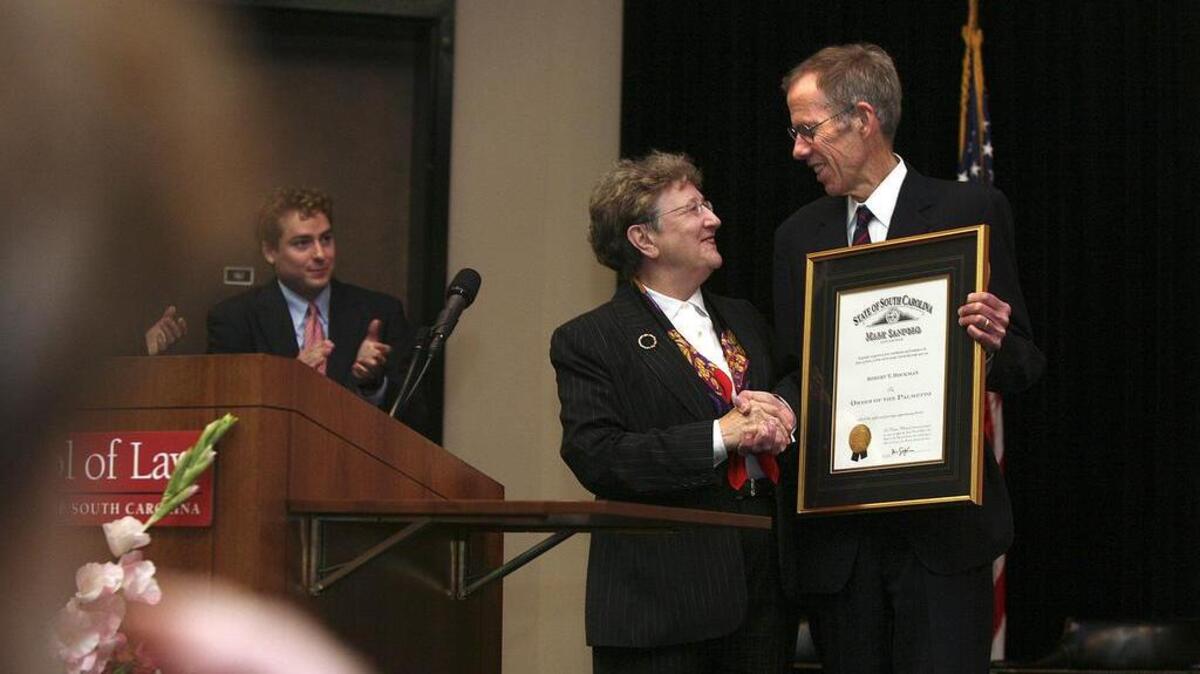 In this 2009 photo, then-SC Chief Justice Jean Toal presents the Order of the Palmetto to USC law school professor Bob Bockman, just named to serve on the PSC.