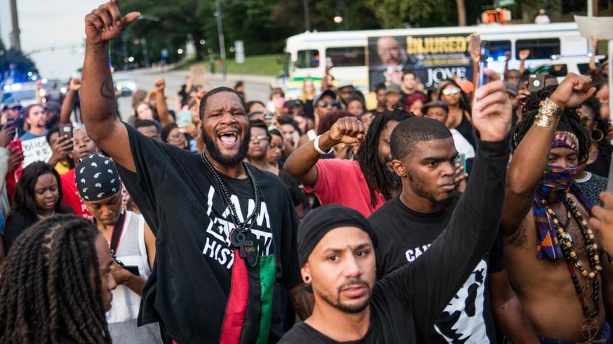 Protestors block traffic at Gervais and Assembly streets during a July 10 march through downtown Columbia.