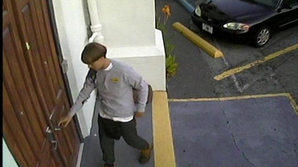 A photo from security footage shows Dylann Storm Roof entering Emanuel African Methodist Episcopal Church in Charleston before killing nine people.