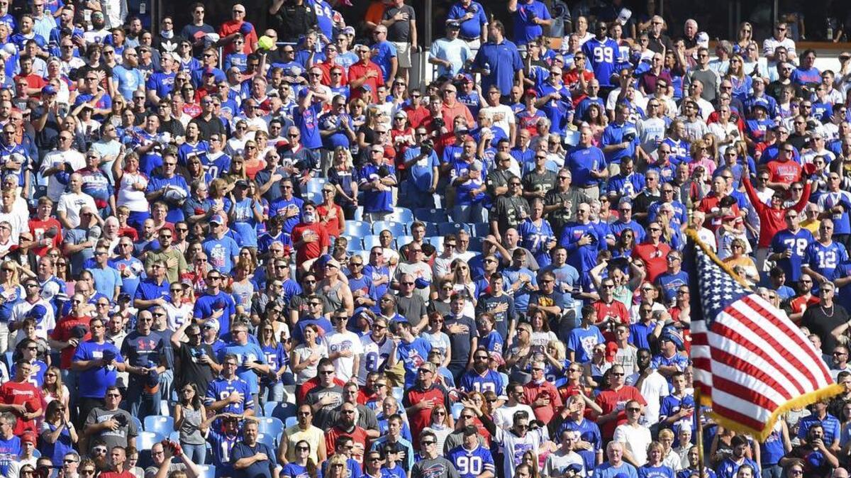 Fans stand during the National Anthem before an NFL football game on Oct 22.