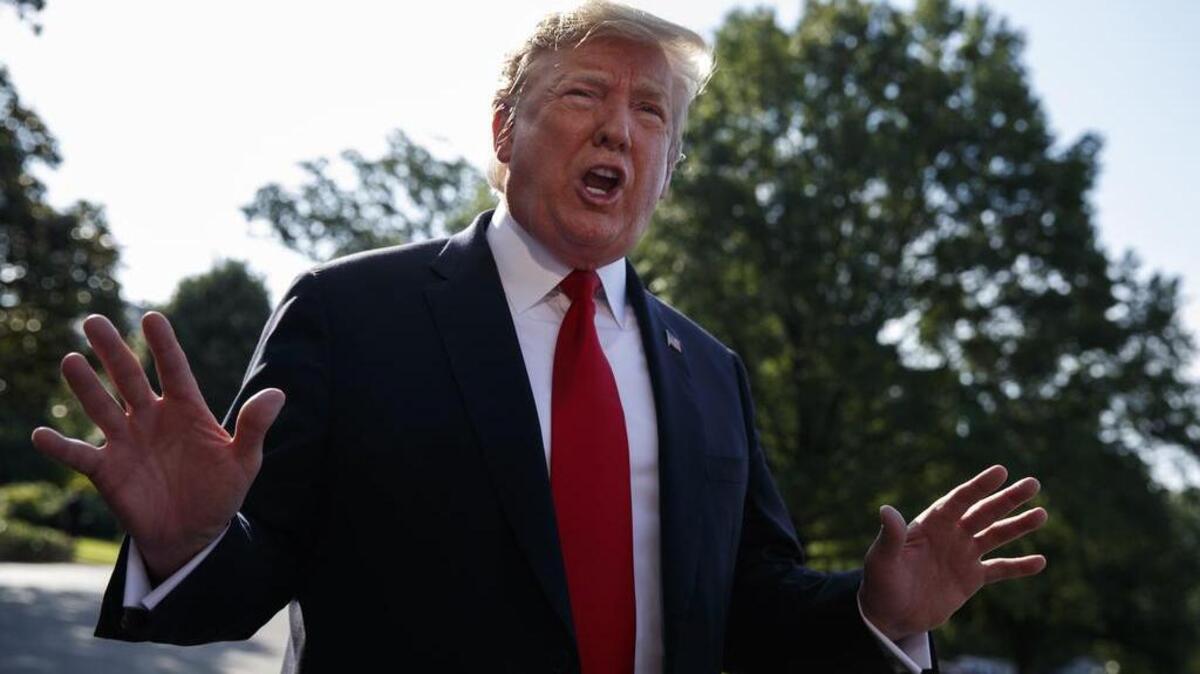 President Donald Trump talks with reporters before departing on Marine One for the Air Force Academy graduation ceremony, Thursday, May 30, 2019, in Washington. (AP Photo/Evan Vucci)