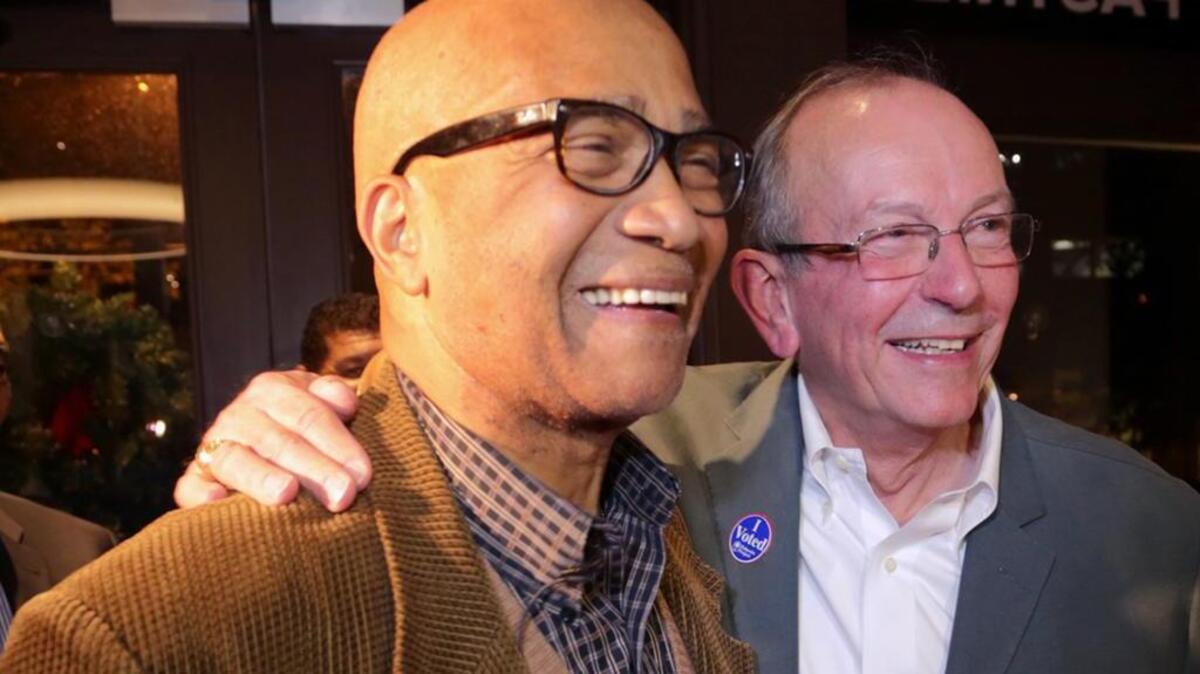 Ed McDowell celebrates with Howard Duvall after both were elected last month to the Columbia City Council.