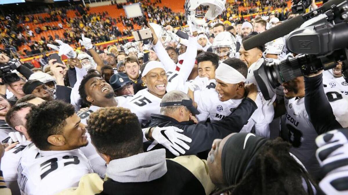 The Missouri football team celebrates after its victory over BYU on Saturday.