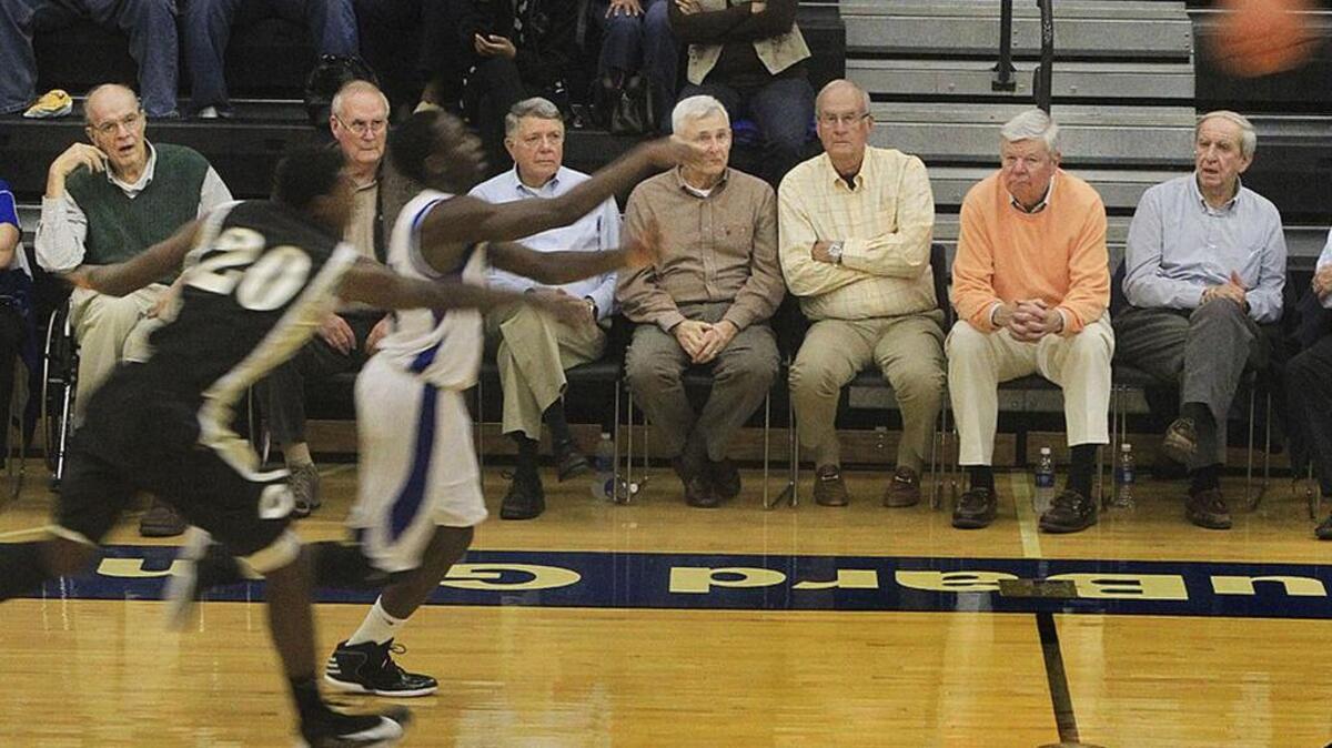 Jim Leventis, left, and other members of the Dreher High School 1956 state championship team watch the 2013 team play.