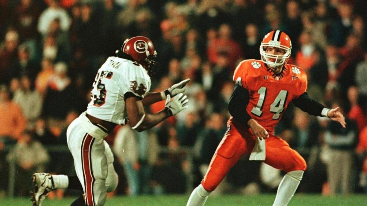 Clemson quarterback Brandon Streeter unloads a pass on his way to a 28-19 defeat of USC in 1998.