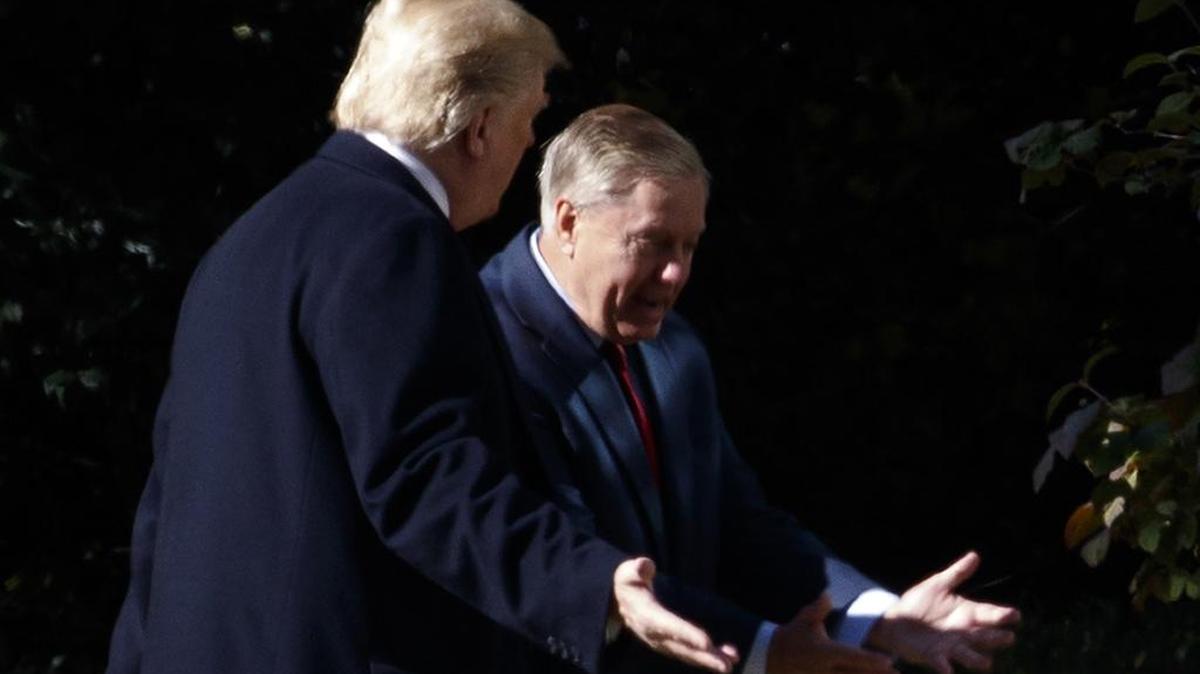 President Donald Trump walks to the Oval Office with Sen. Lindsey Graham, R-S.C., Thursday, Nov. 8, 2018, in Washington.