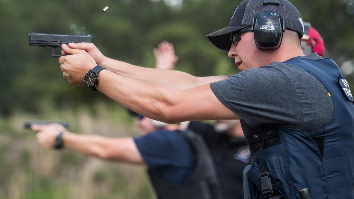 Police compete in a firing exercise during the Law Enforcement Training for Safety and Survival program in April.
