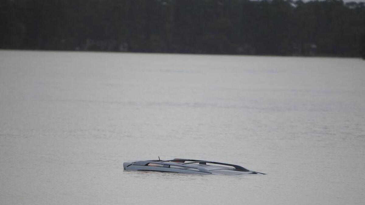 A car is submerged in Lake Katherine.