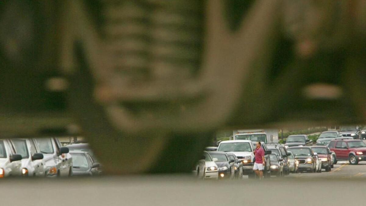 Traffic backed up in Columbia can be seen through the wheels of a train that’s blocking city streets — again.