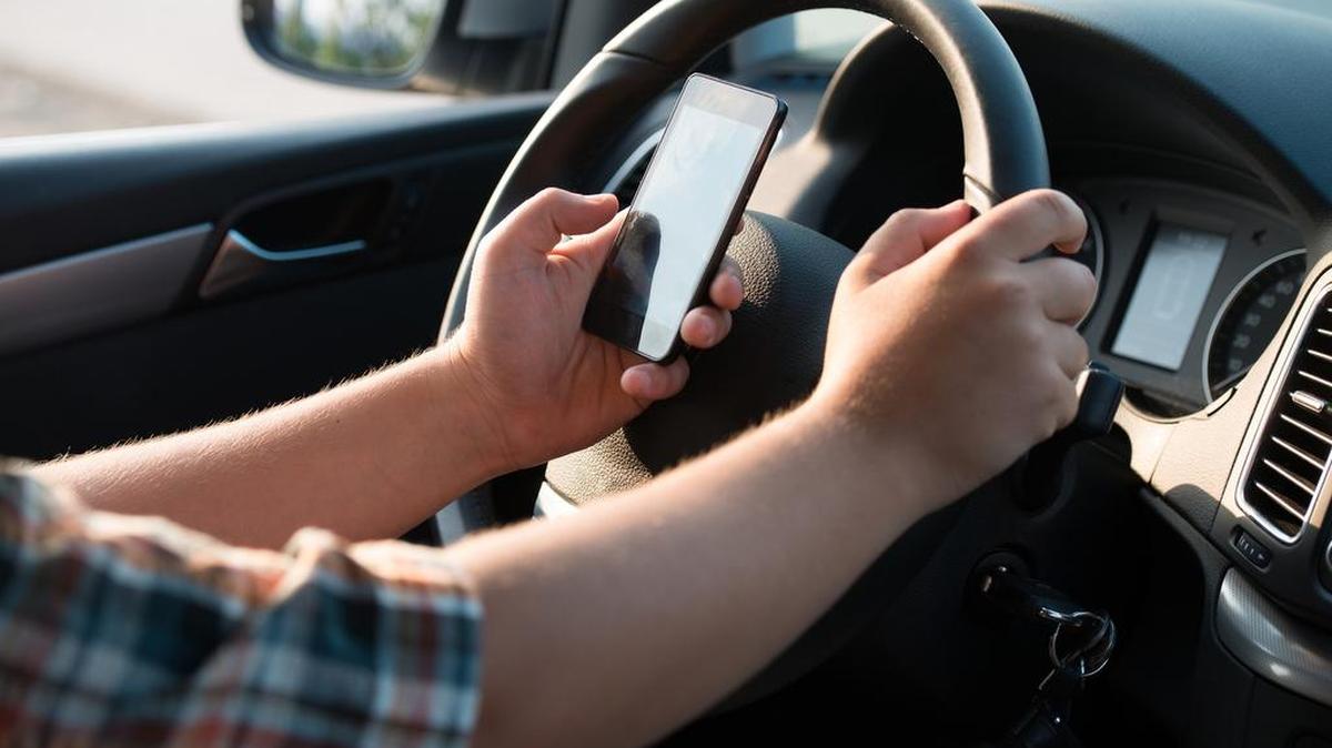 Many drivers have gotten accustomed to checking their phones while driving. Come Sept. 1, it will be illegal.