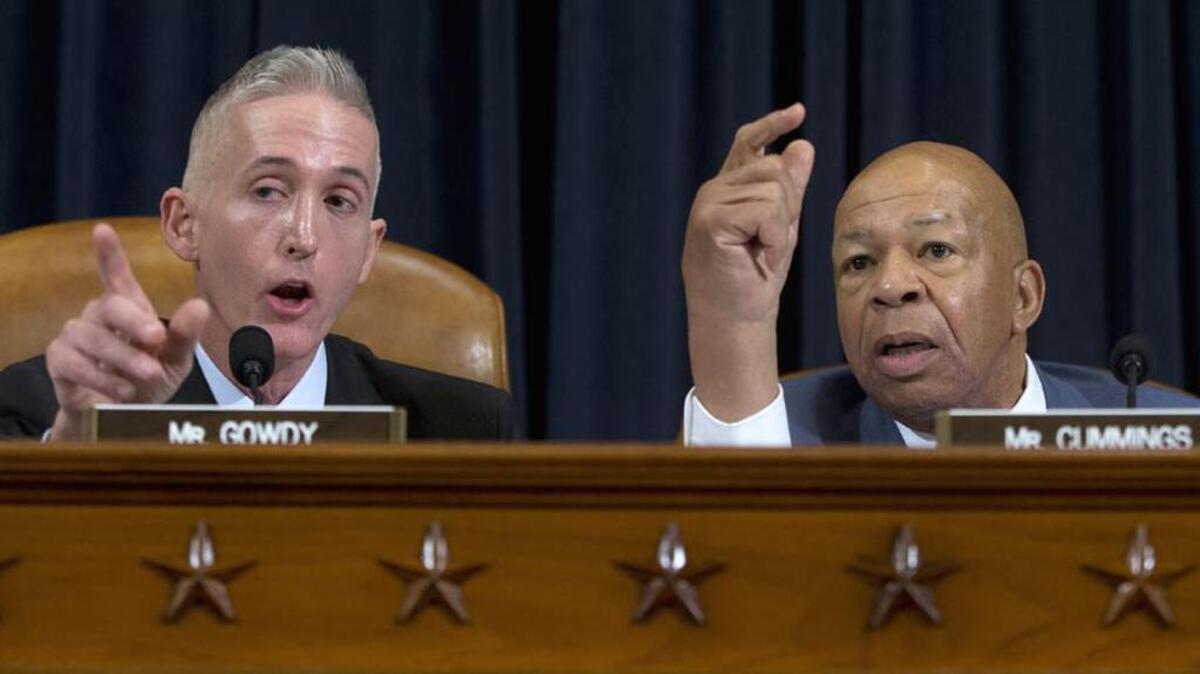 House Benghazi Committee Chairman Rep. Trey Gowdy, R-S.C., left, and the committee's ranking member Rep. Elijah Cummings, D-Md., have a heated discussion as Democratic presidential candidate, former Secretary of State Hillary Rodham Clinton testifies before the committee.