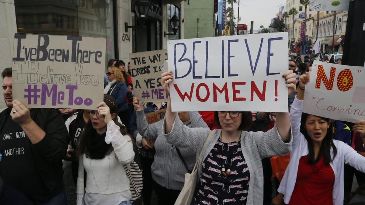 Participants march against sexual assault and harassment at the #MeToo rally.