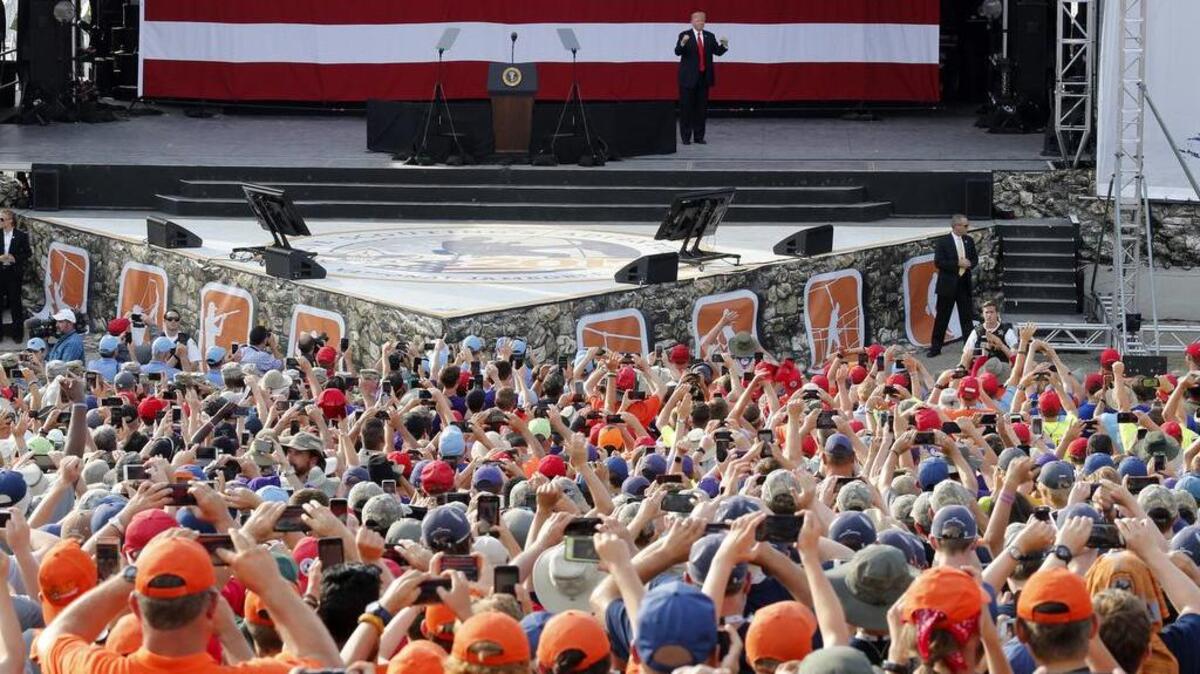 President Donald Trump waves to the crowd of scouts at the 2017 National Boy Scout Jamboree.