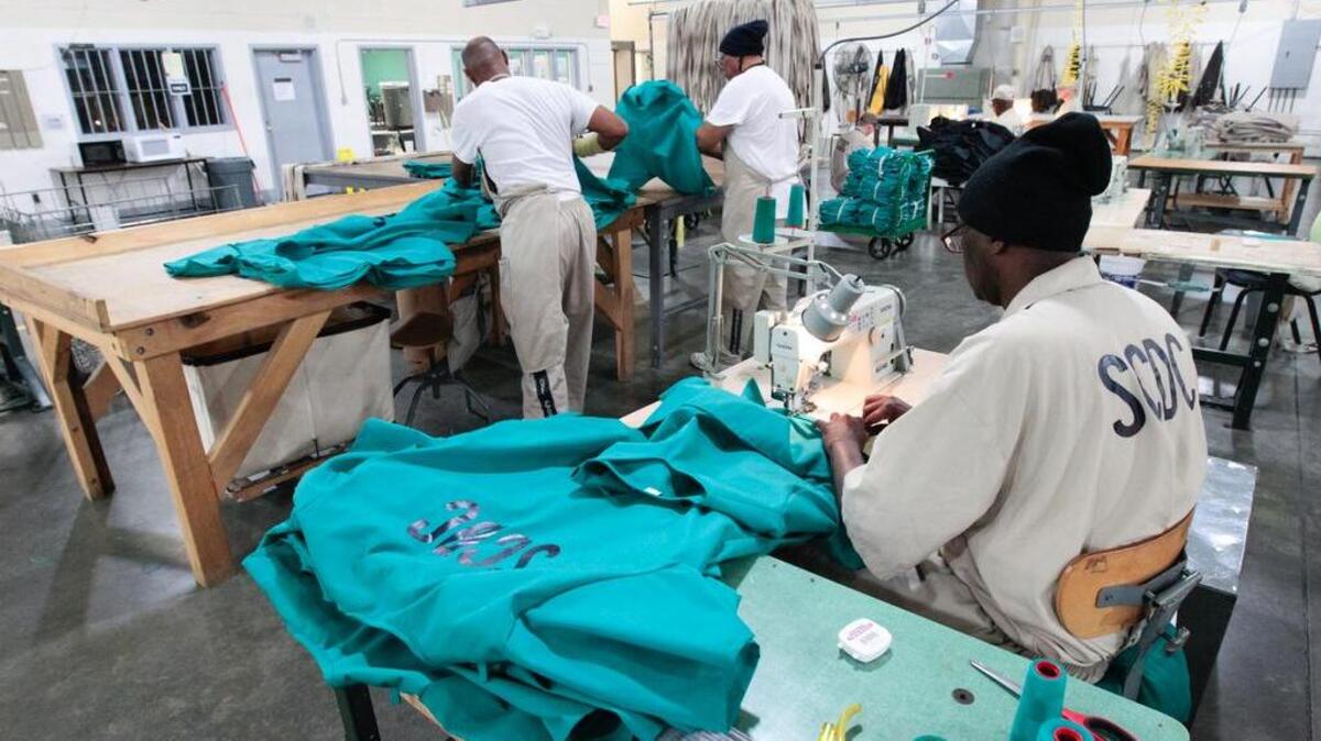 
Inmates make prison uniforms at the prison industries program at Lee Correctional Institution.

