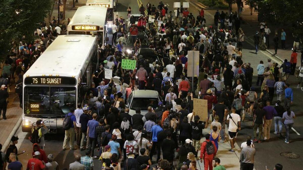 Demonstrators protest the fatal police shooting of Keith Lamont Scott in Charlotte.