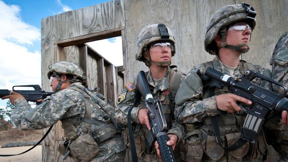 Female soldiers learn urban assault tactics during training at Fort Jackson.