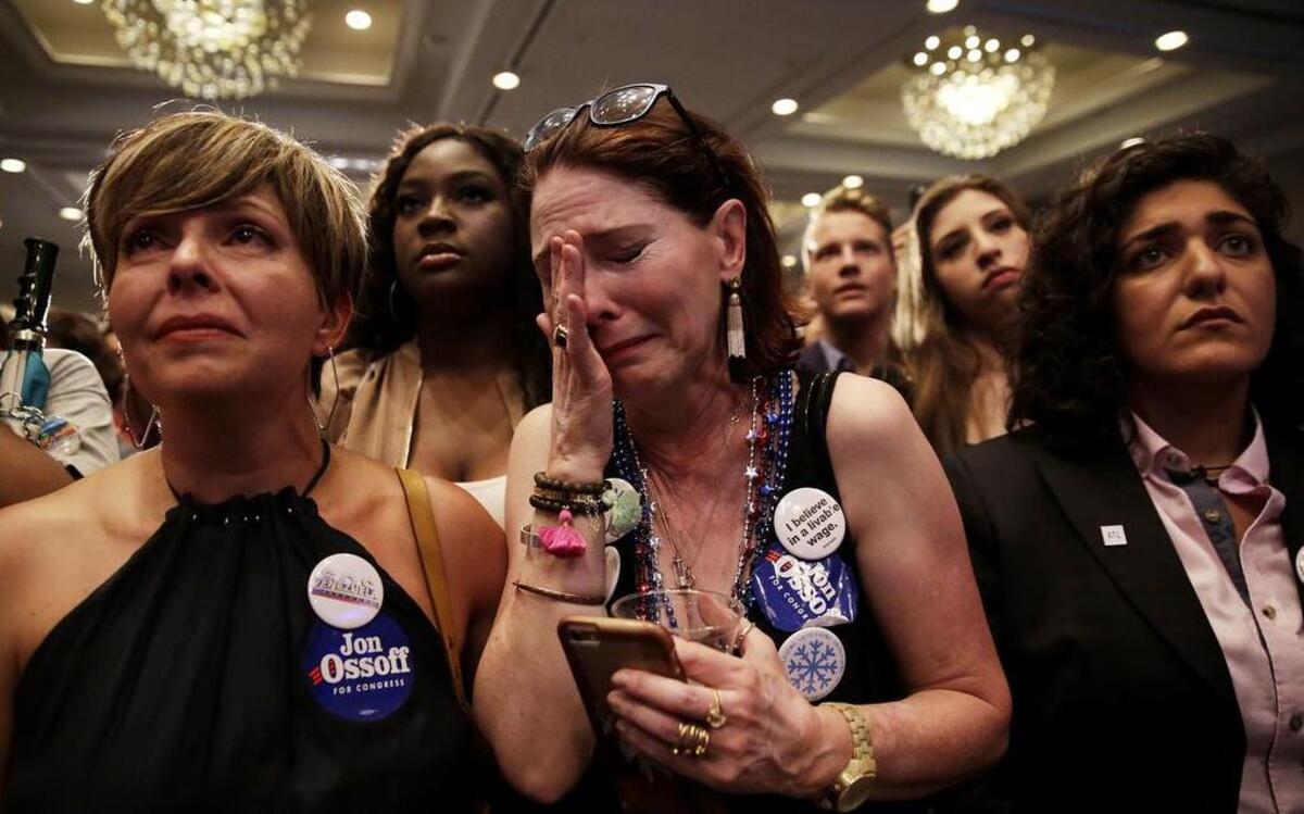 Supporters cry as Democratic candidate for 6th congressional district Jon Ossoff concedes to Republican Karen Handel last month.