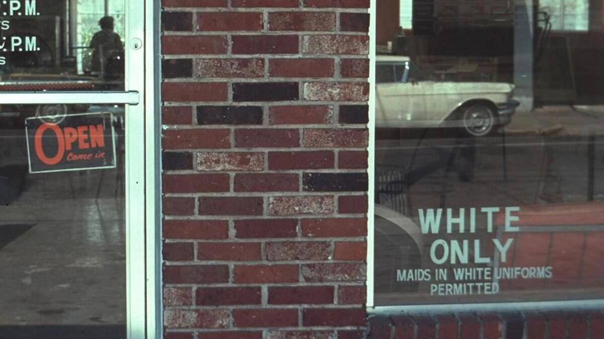 A “White Only” sign is shown on a business in Louisiana in this undated file photo.