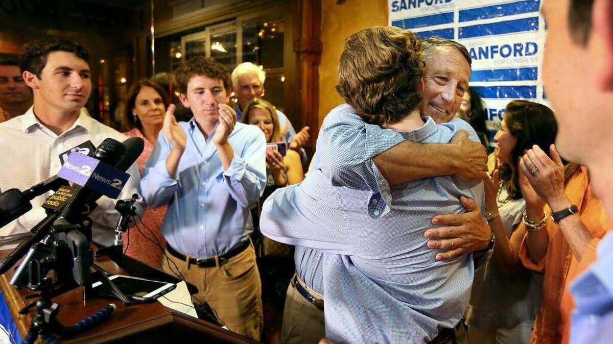 US Rep. Mark Sanford hugged his sons after his defeat in the June 12 Republican primary to state Rep. Katie Arrington.