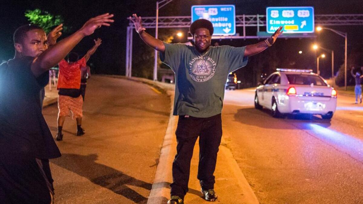 Protestors stand in the road where Columbia’s Huger Street becomes Interstate 126 during a July 10 march.