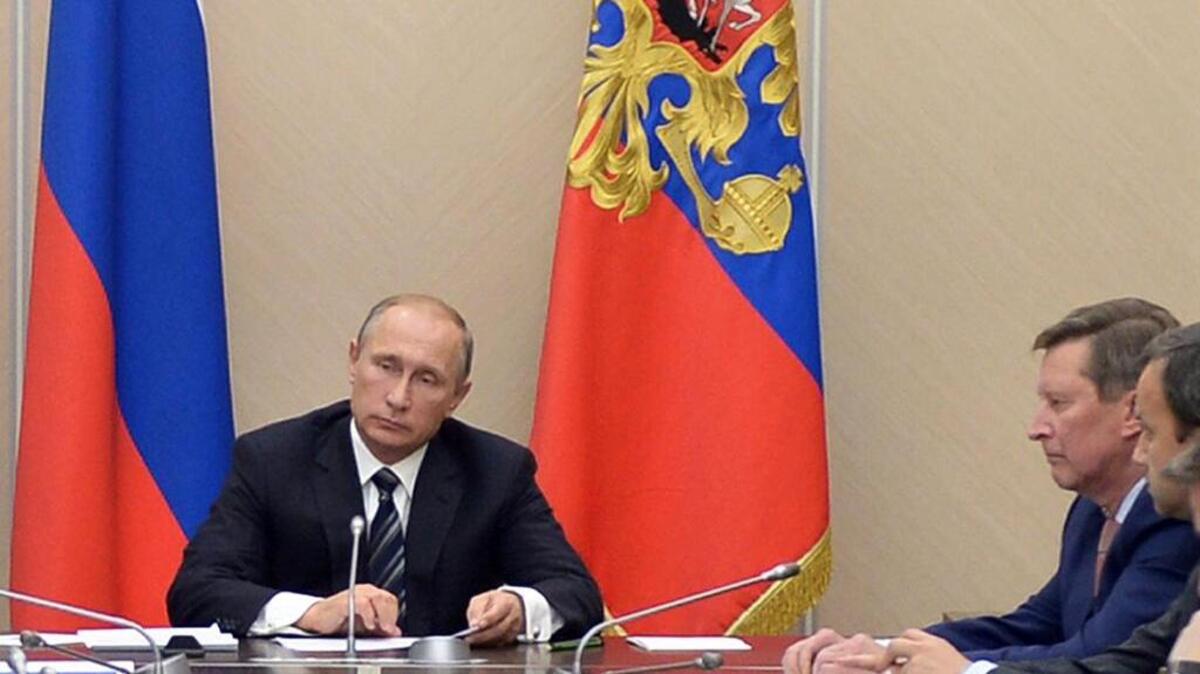 
Russian President Vladimir Putin holds a meeting with senior government officials as Russian military jets carry out airstrikes in Syria.
