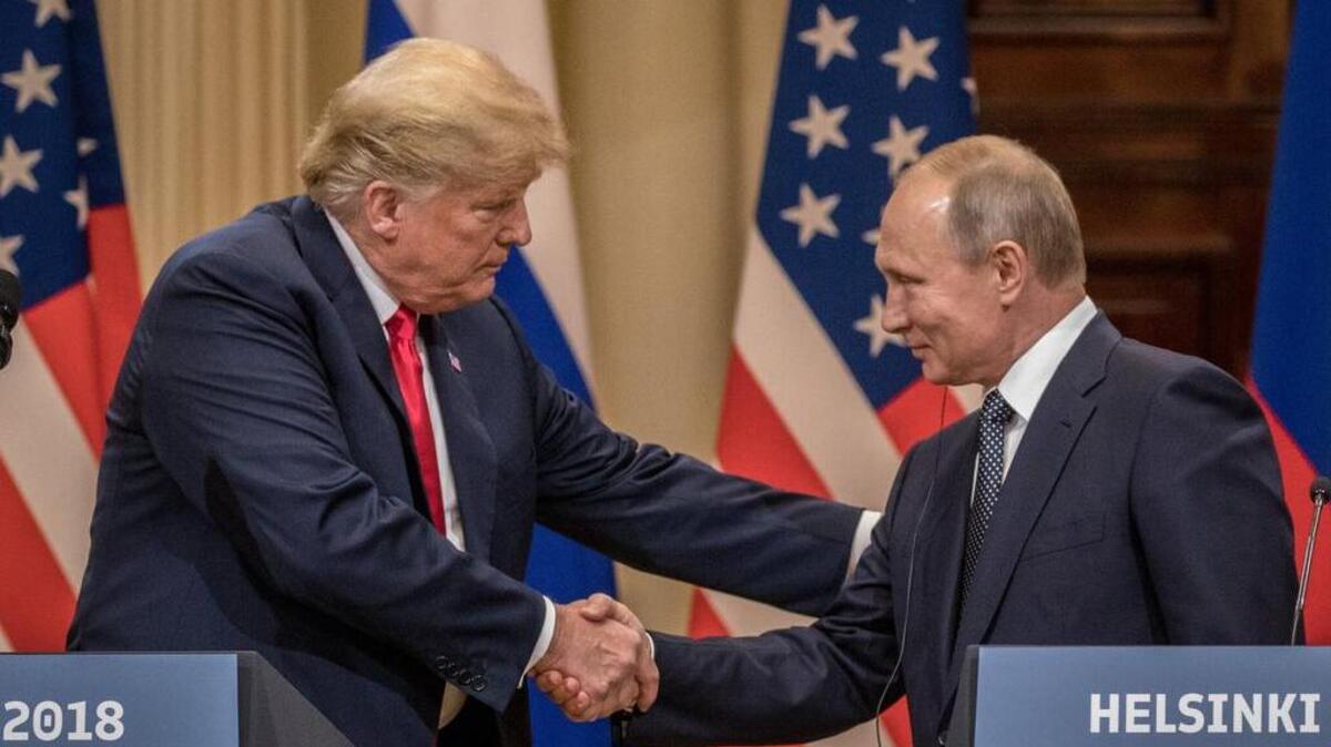 President Donald Trump and Russian President Vladimir Putin shake hands after their summit on July 16, 2018 in Helsinki, Finland.